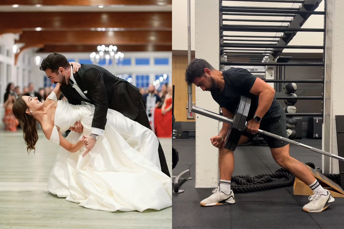 Coach is working out in the gym by lifting a barbell.